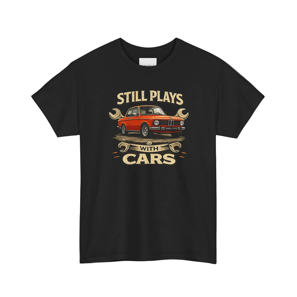 Black t-shirt with a graphic of a red car and text 'Still Plays with Cars' on a white background