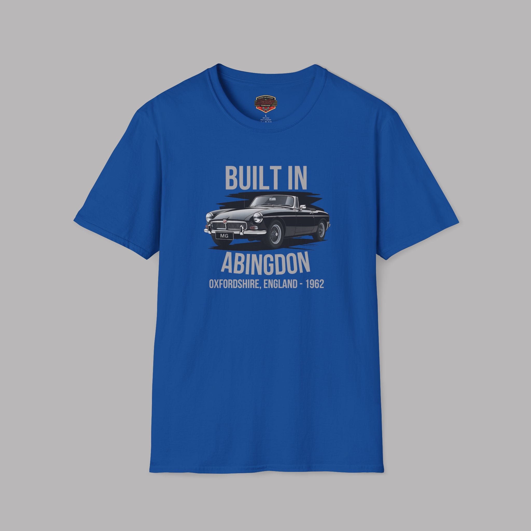 Royal blue t-shirt with a classic car and gray text on a gray background