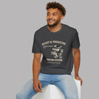 Man wearing a dark heather t-shirt with a graphic supercharged engine design and text, sitting on a white stool against a gray background.