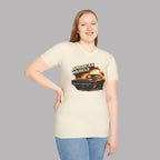 Woman wearing a t-shirt with 'American Muscle' graphic design on a plain background
