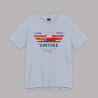 Light blue t-shirt with red classic car graphic and text on a gray background