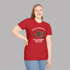 Girl wearing a red t-shirt with a mechanical graphic design on a gray background