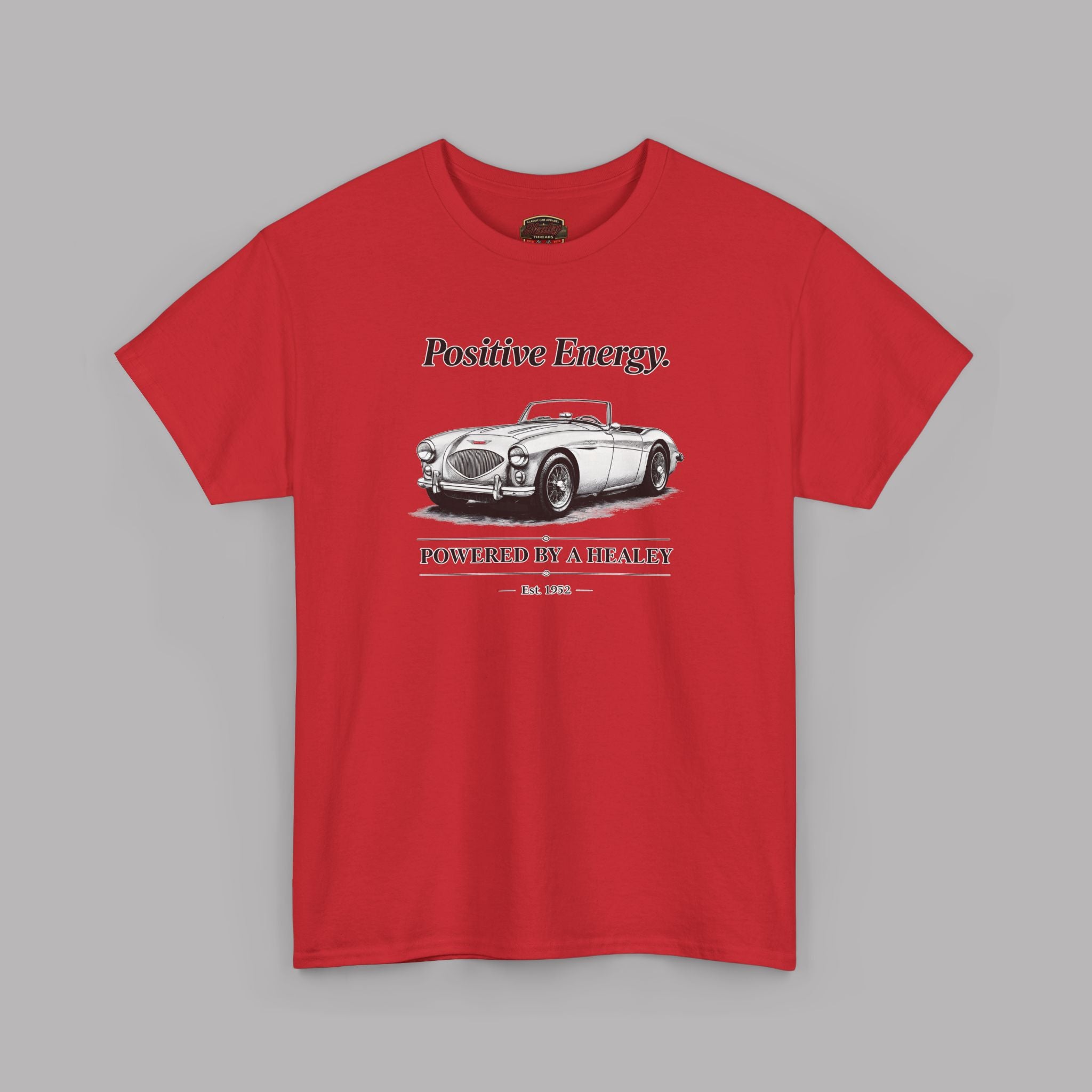 Red t-shirt with a graphic of a vintage car and text on a gray background