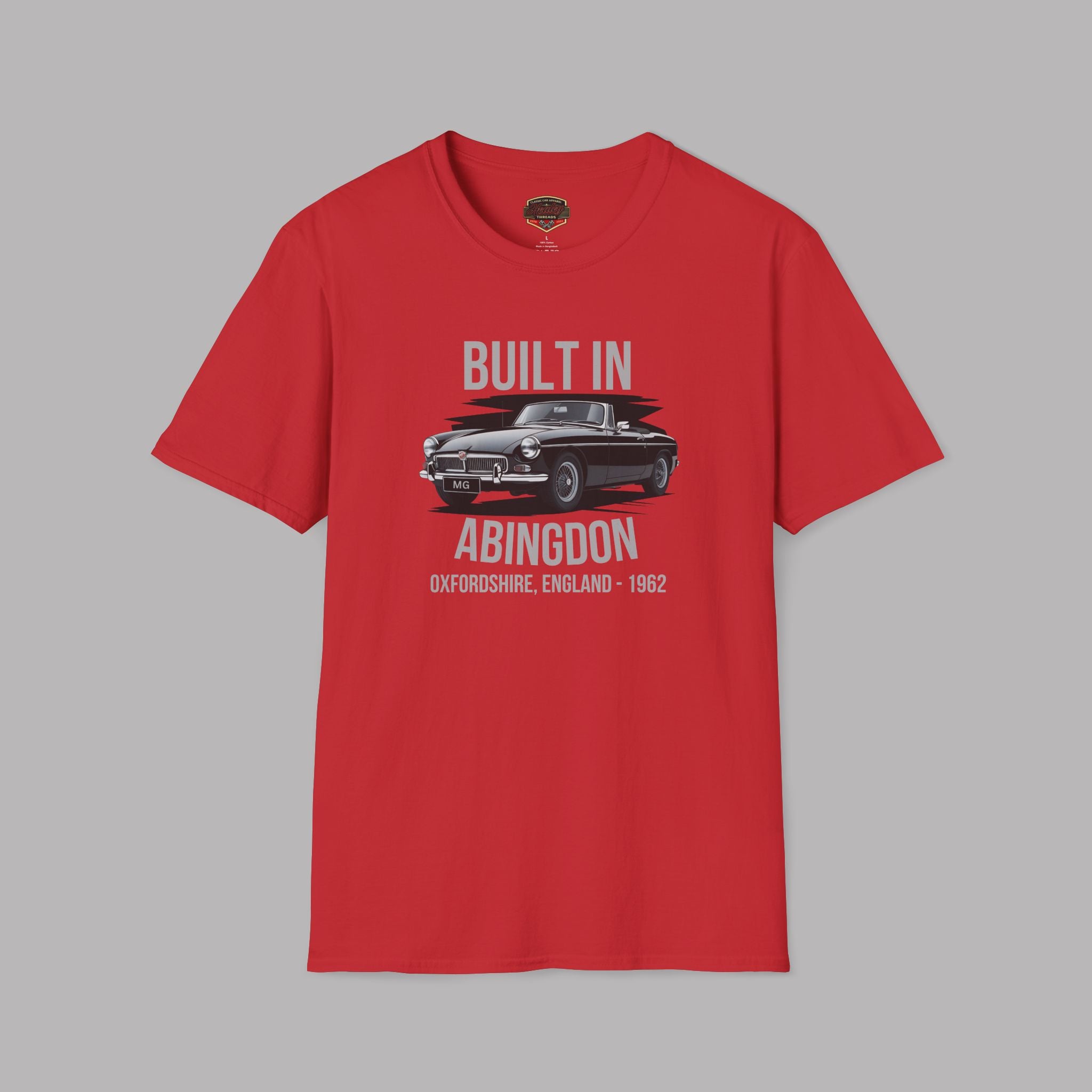 Red  t-shirt with a classic car and gray text on a gray background