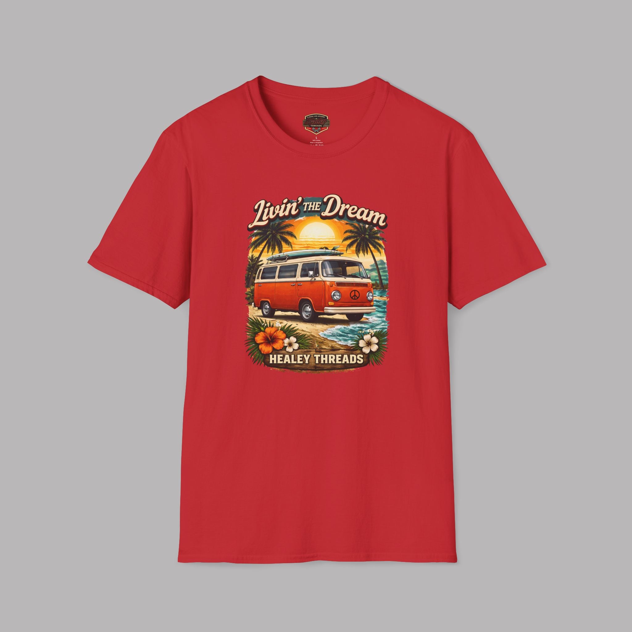 Red t-shirt with a graphic design of a van and palm trees on a gray background
