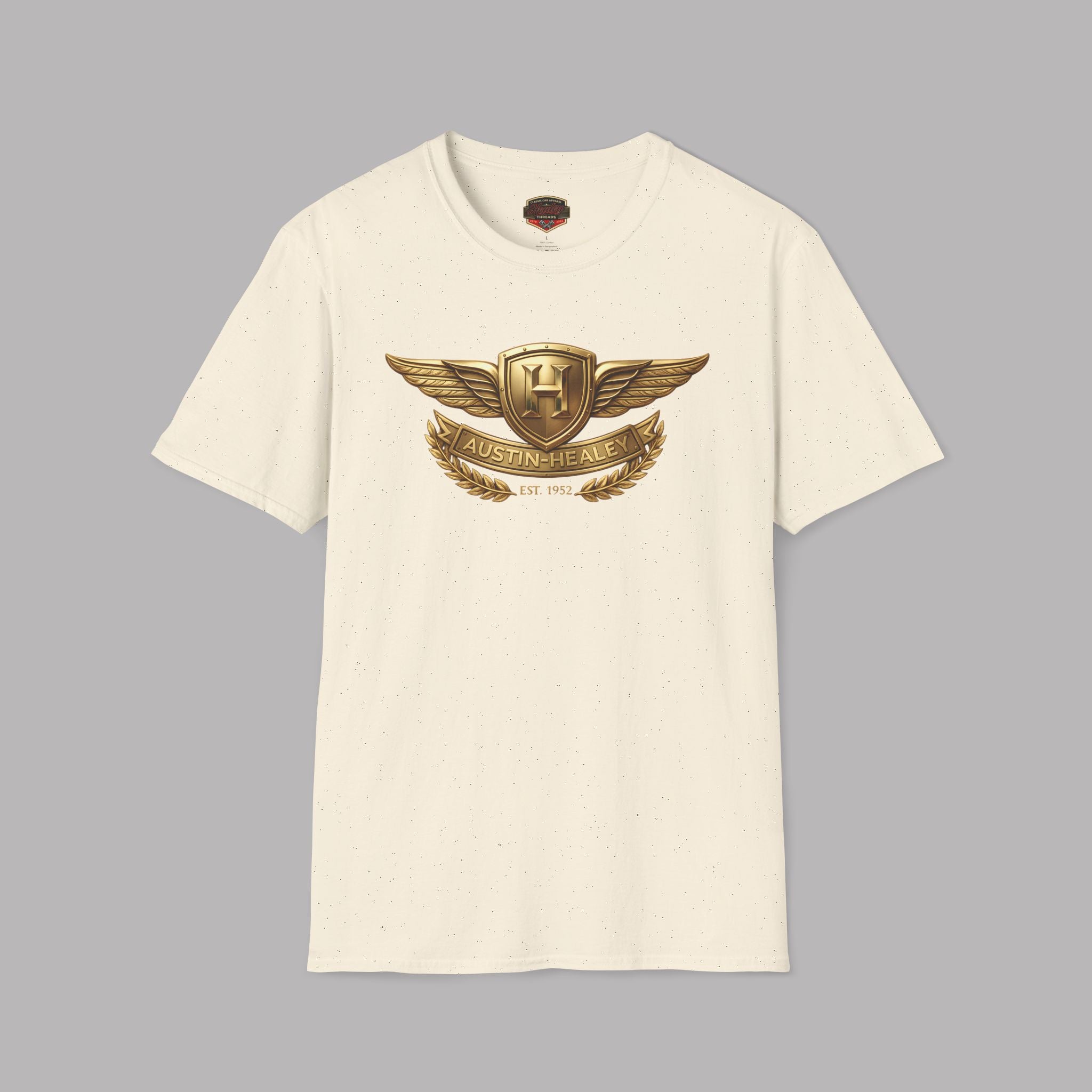 Natural t-shirt with gold Healey emblem on a gray background