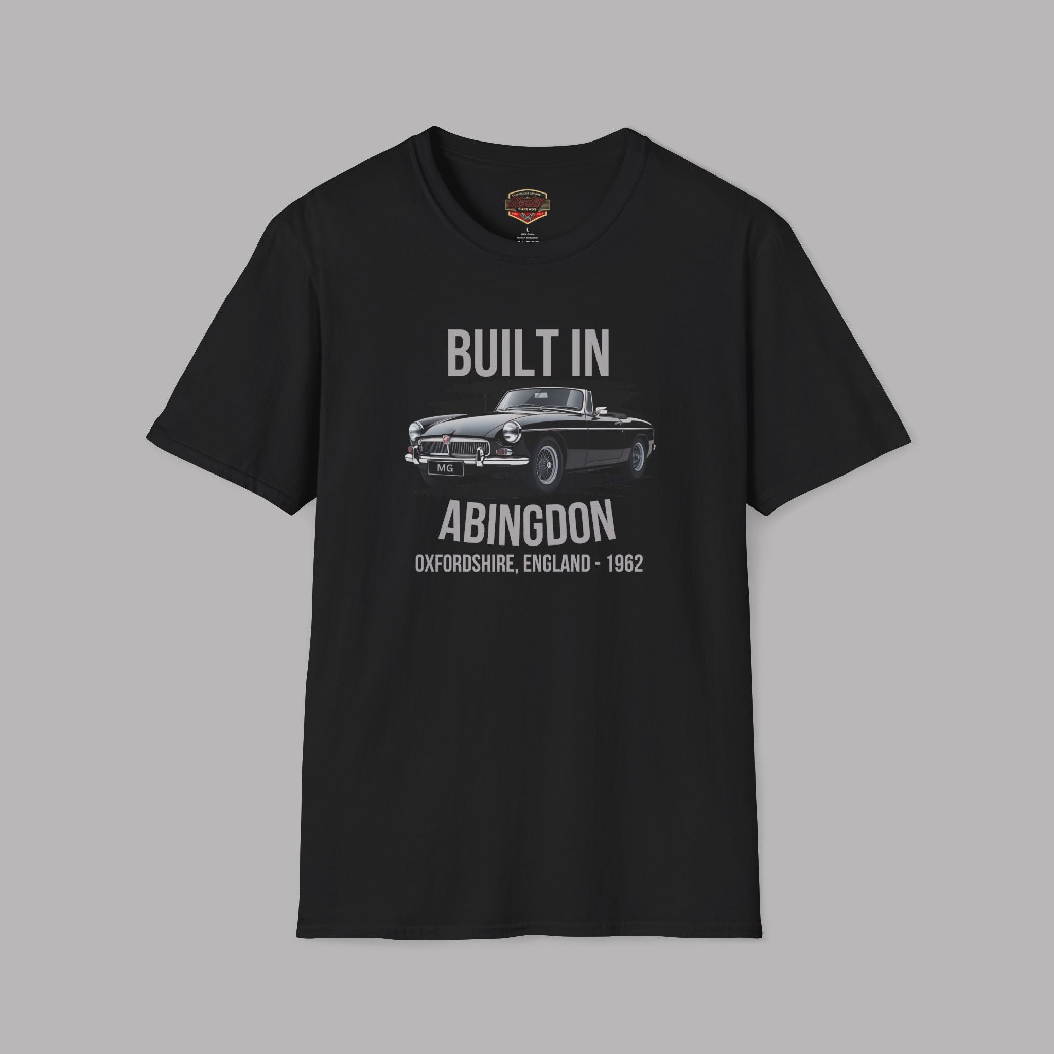 Black t-shirt with a classic car and gray text on a gray background