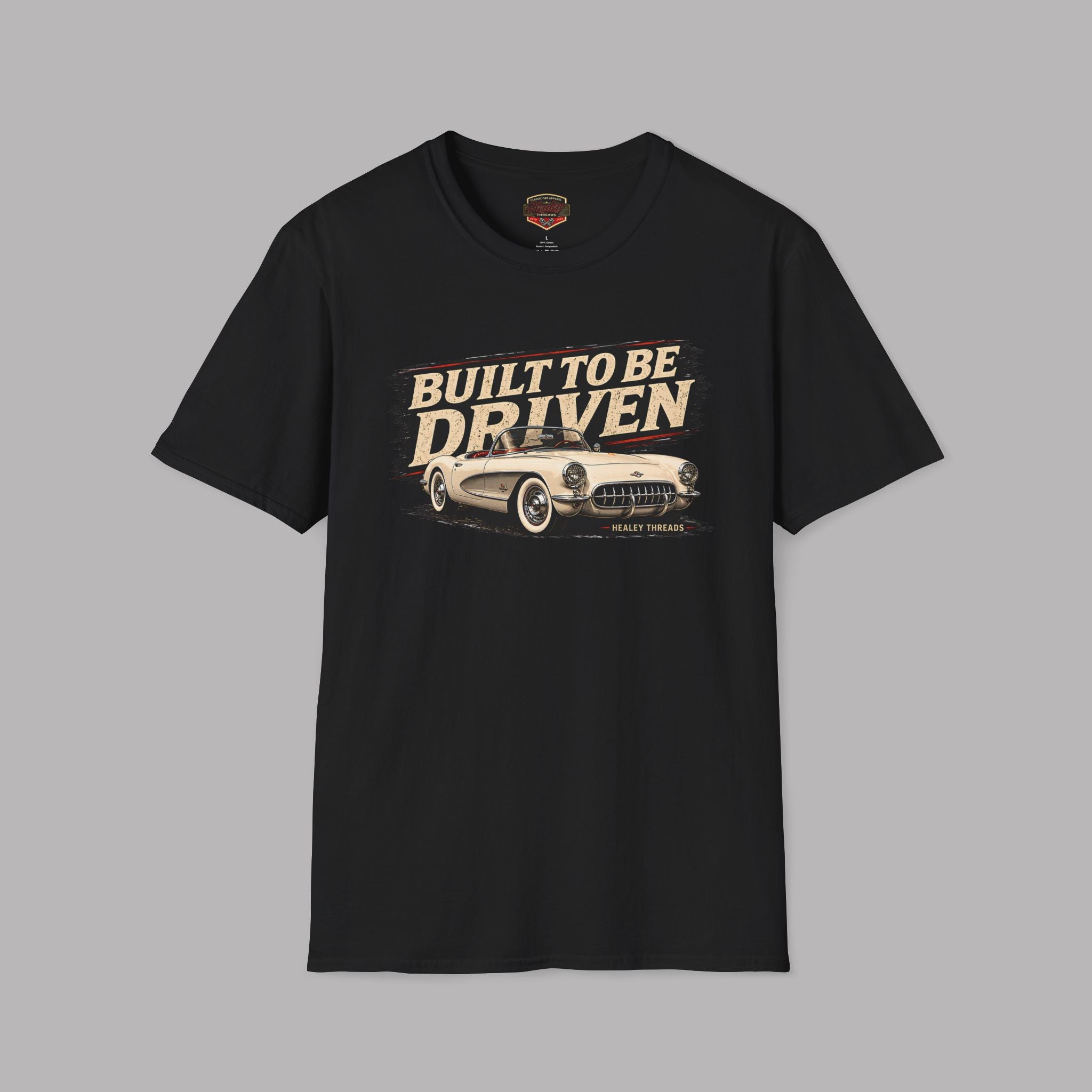 Black t-shirt with 'Built to be Driven' graphic on a gray background