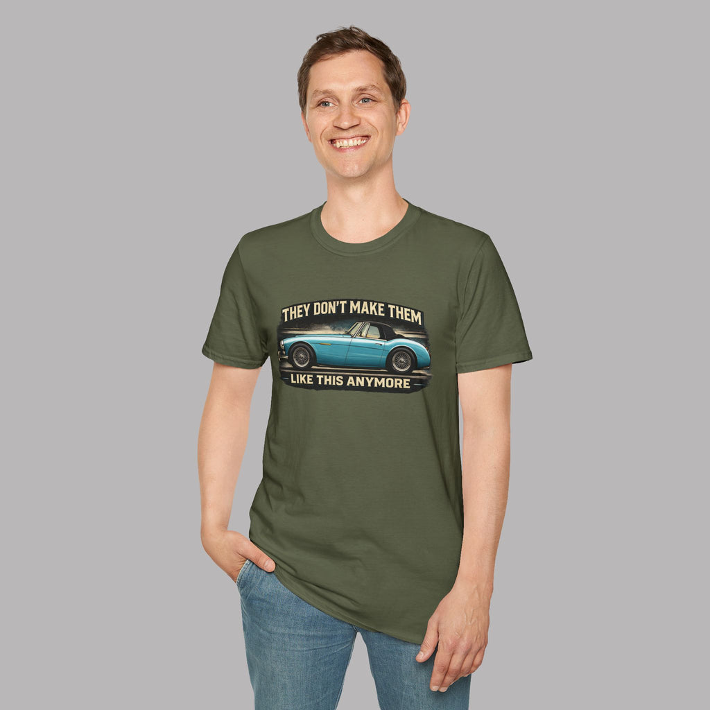 Man wearing a military green t-shirt with a graphic design on a gray background