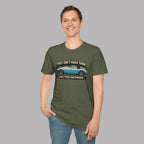 Man wearing a military green t-shirt with a graphic design on a gray background
