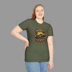 Woman wearing a military green t-shirt with a classic car design and text on a gray background