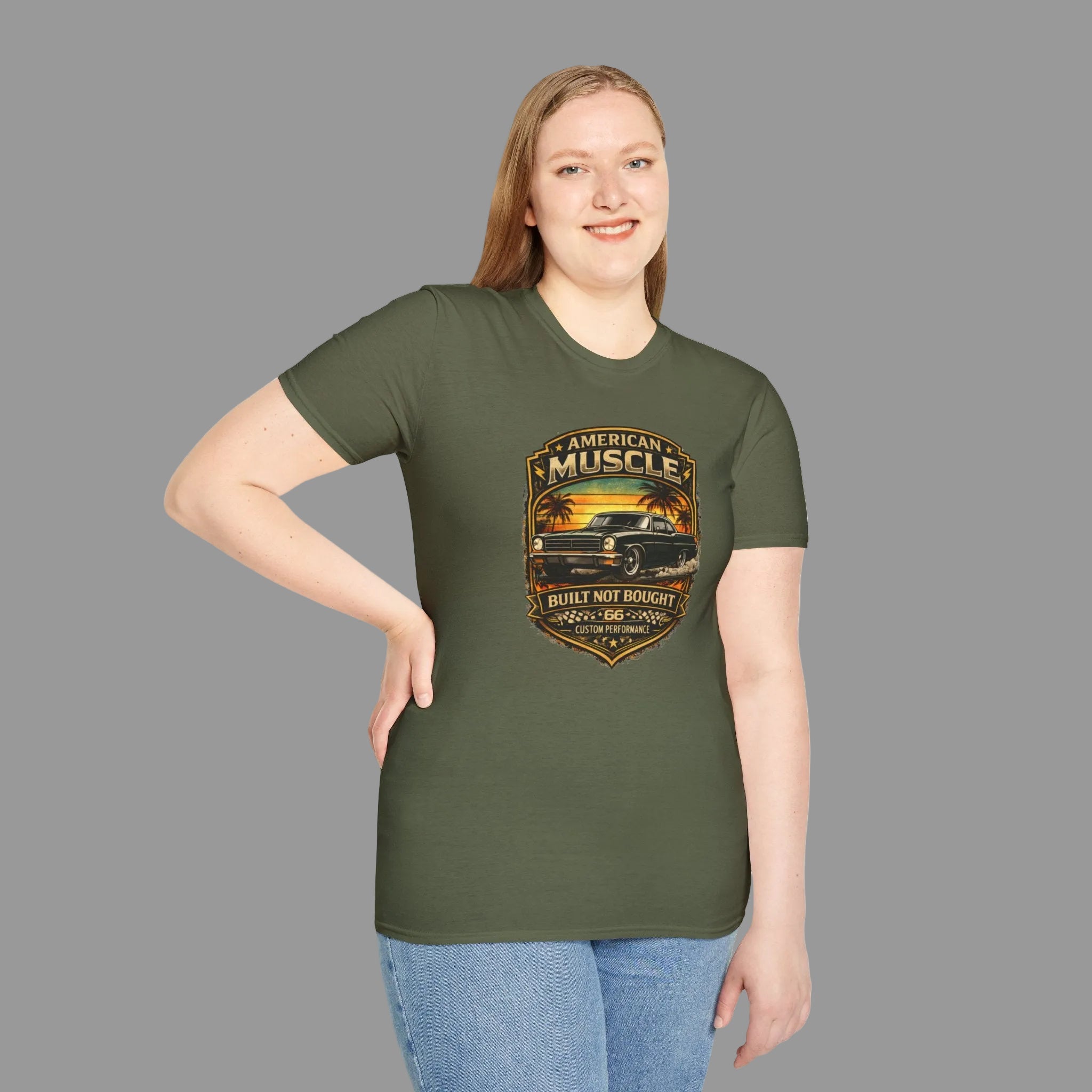 Woman wearing a military green t-shirt with a classic car design and text on a gray background