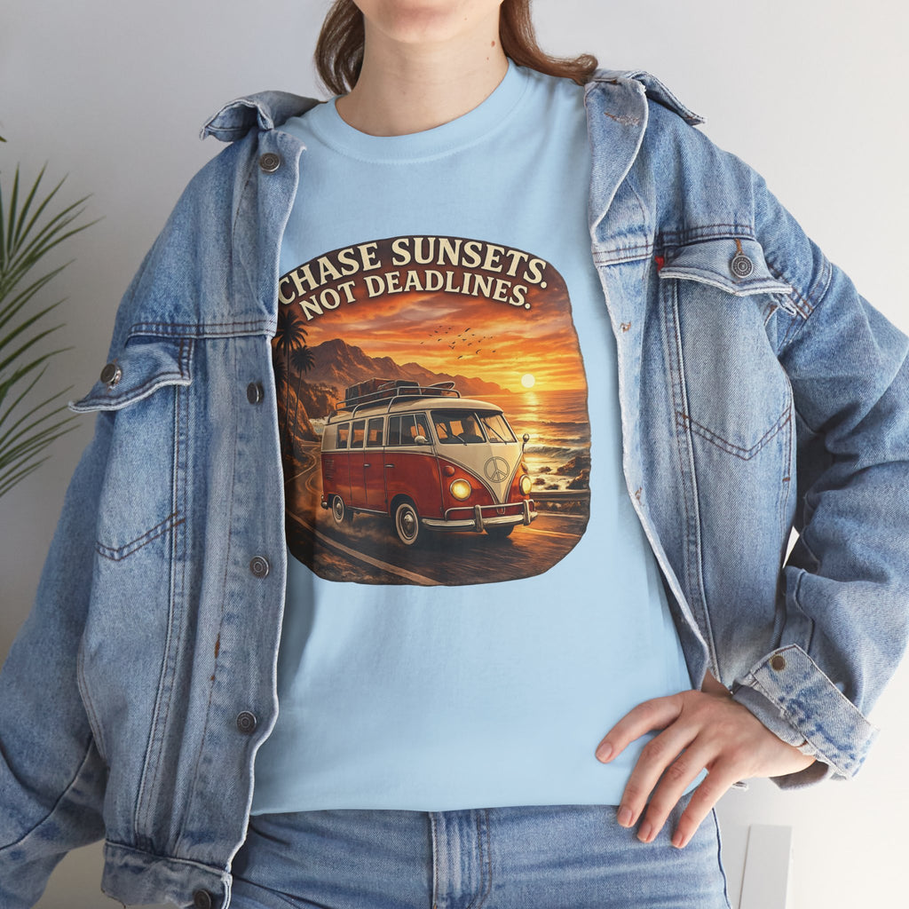 Woman wearing a light blue t-shirt with a classic red van graphic design and denim jacket.