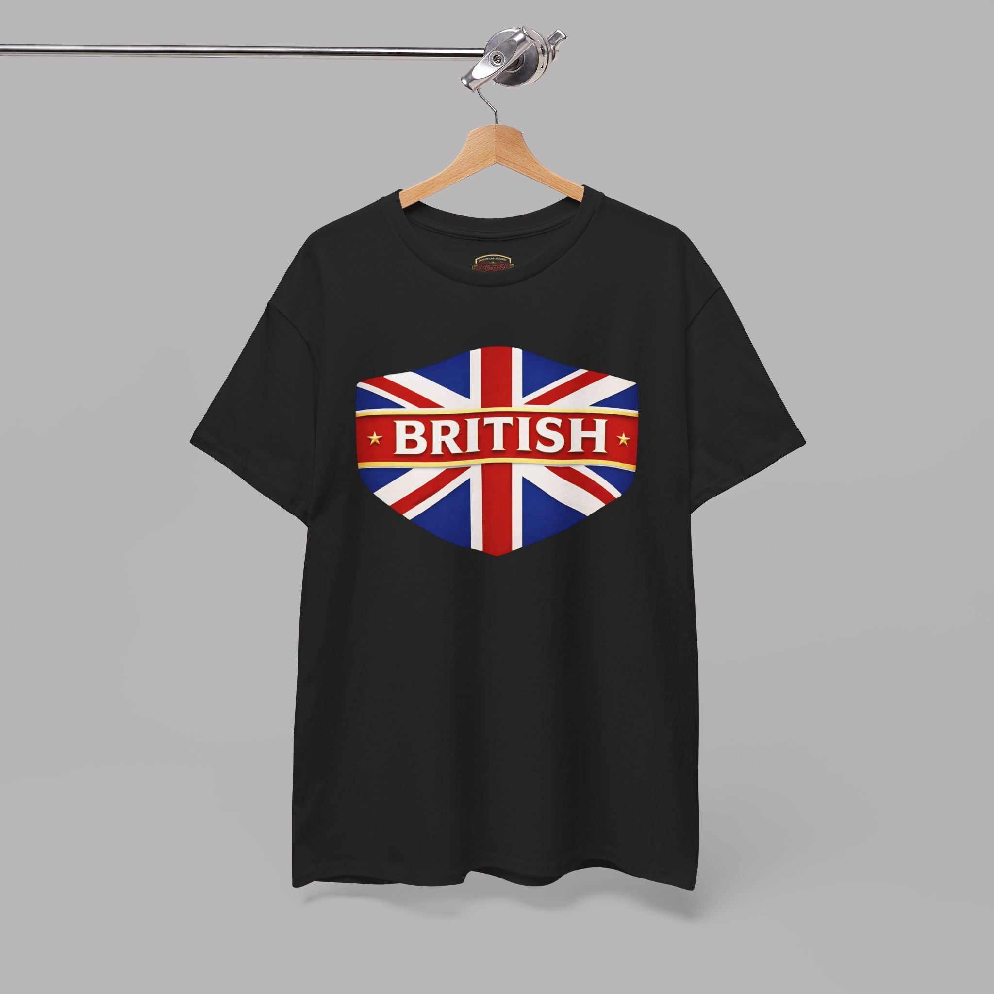 Black t-shirt with British flag design on a hanger against a gray background