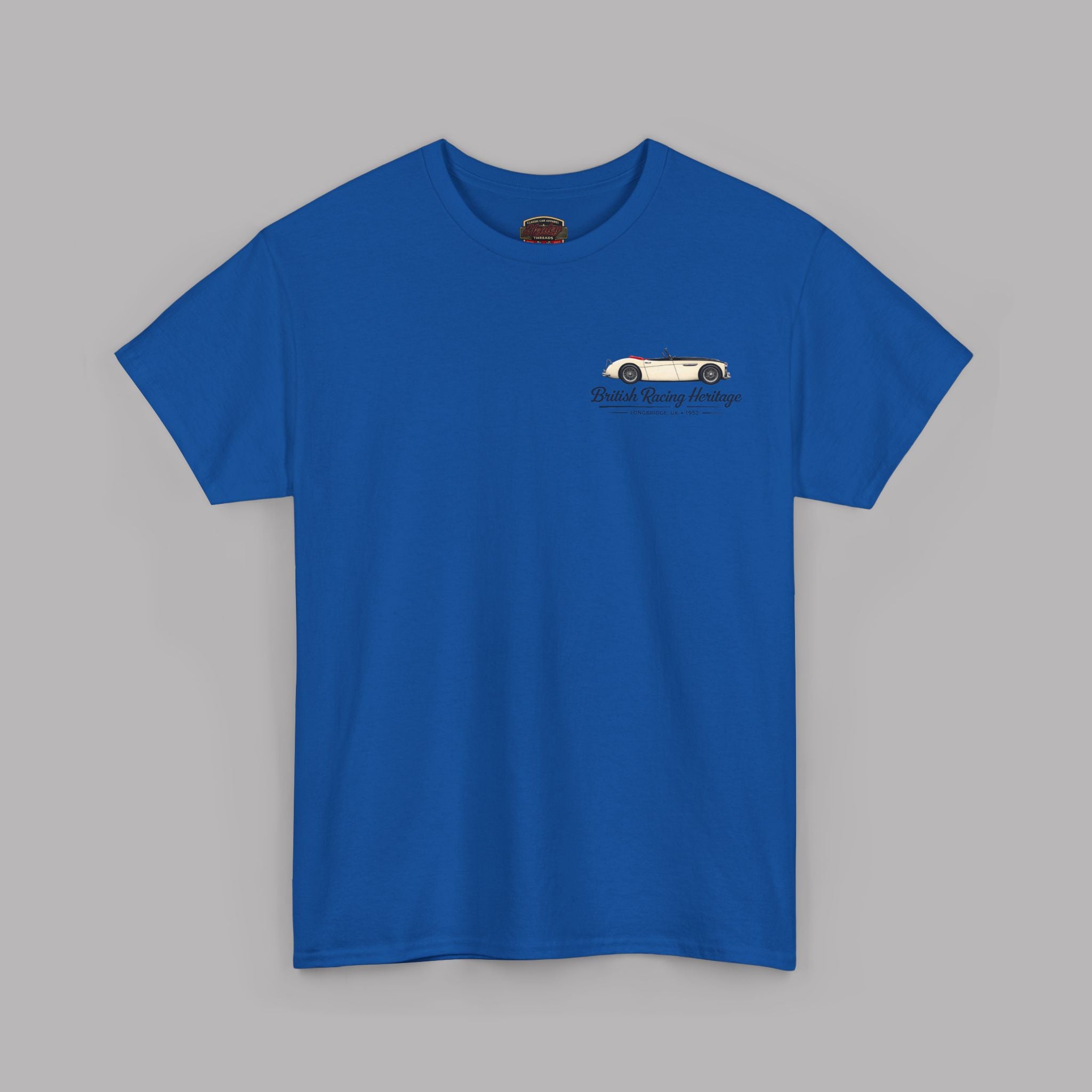 Front of a royal blue t-shirt with a Healey classic car graphic design on a gray background