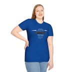 Girl wearing a blue t-shirt with a graphic design on a white background