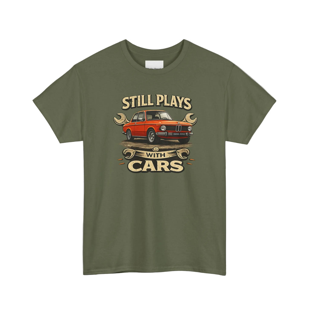 Military green t-shirt with a graphic of a red car and text 'Still Plays with Cars' on a white background