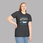 Woman wearing a dark heather t-shirt with a Healey graphic and text on a gray background