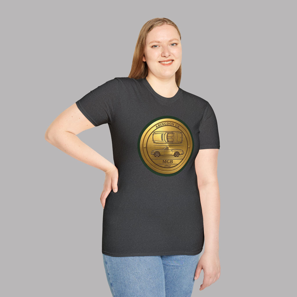 Woman wearing a dark heather t-shirt with a gold classic car emblem on a gray background