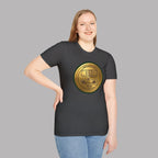 Woman wearing a dark heather t-shirt with a gold classic car emblem on a gray background