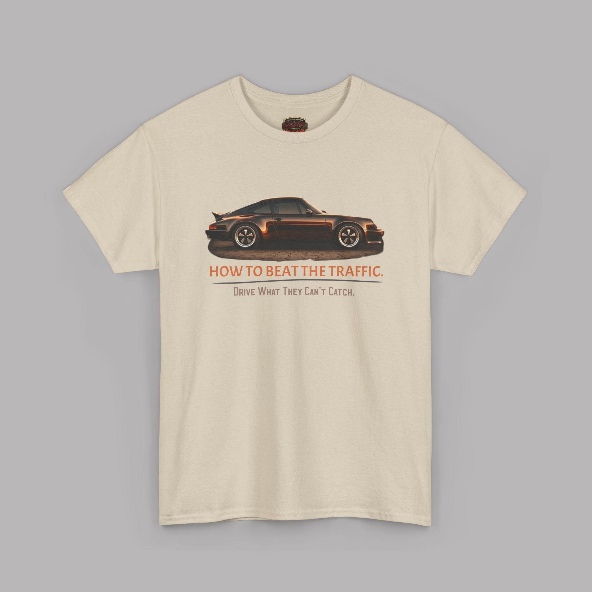 Sand t-shirt with a car graphic and text on a gray background