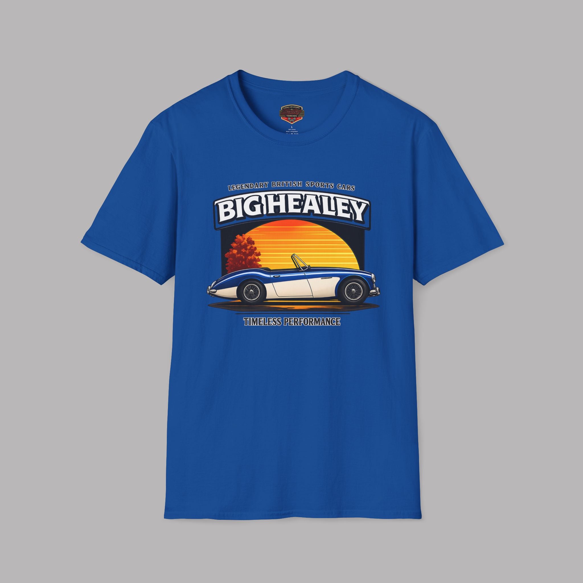 Big Healey graphic royal blue colored t-shirt featuring a blue and white Austin Healey roadster with retro sunset artwork and vintage British sports car typography by Healey Threads