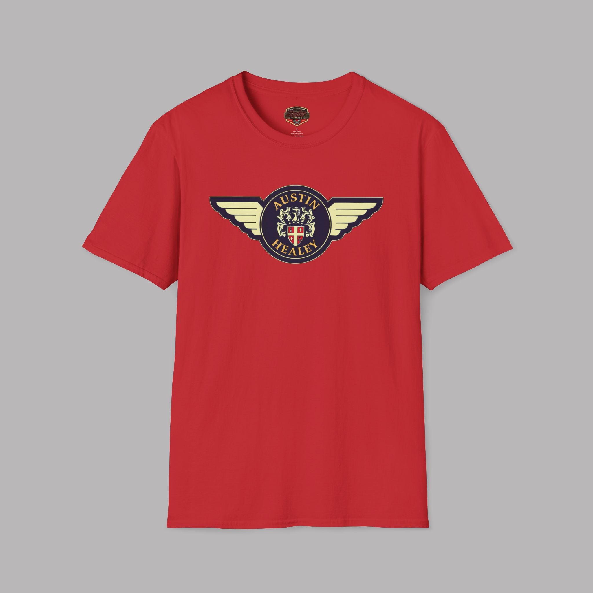 Red t-shirt with a winged Austin Healey logo on a gray background. 