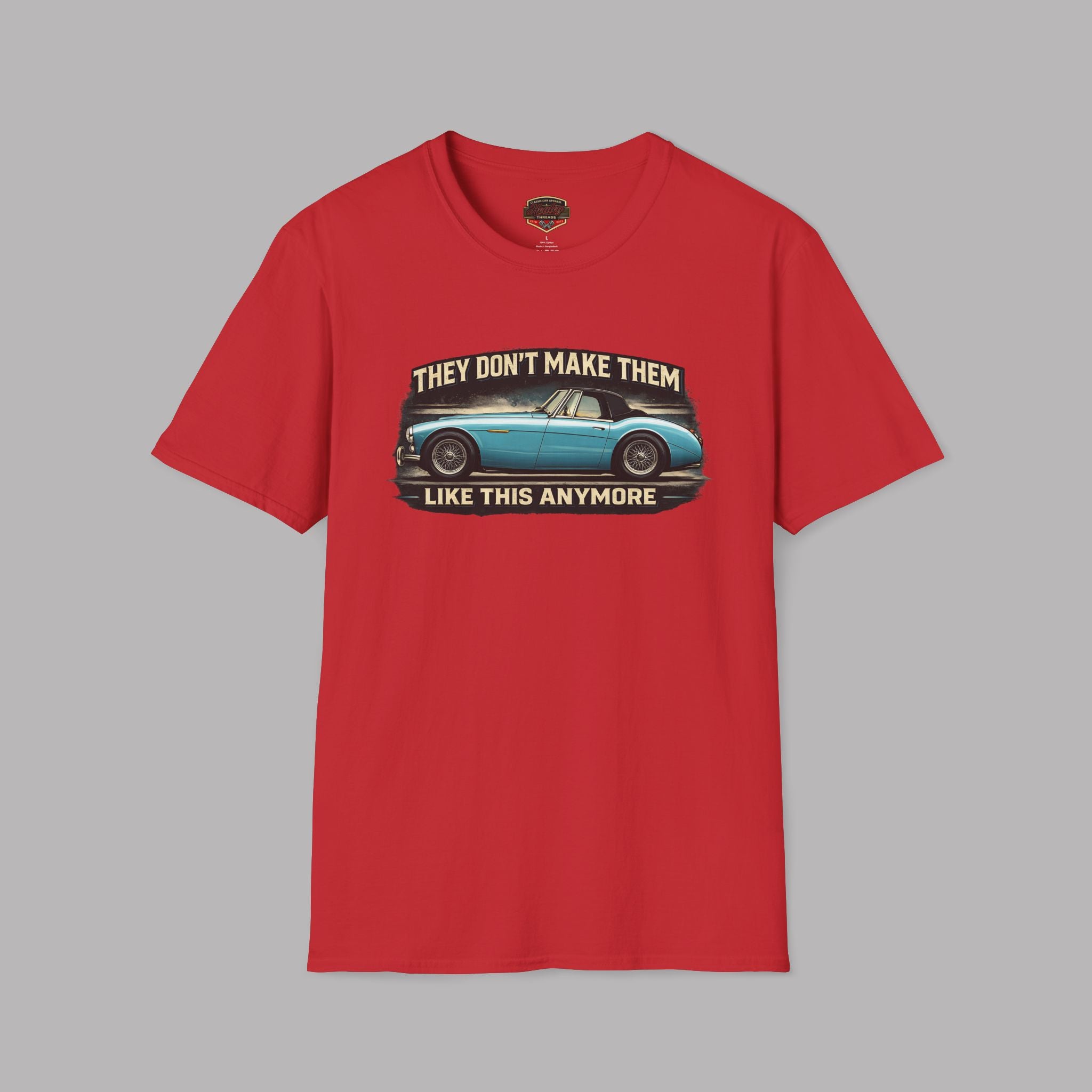 Red t-shirt with graphic design and text on a gray background
