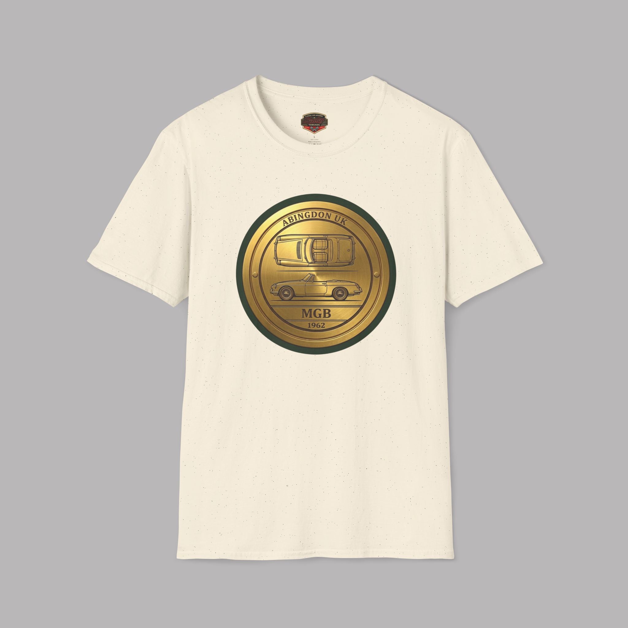 Natural t-shirt with a gold and black classic car emblem on a gray background