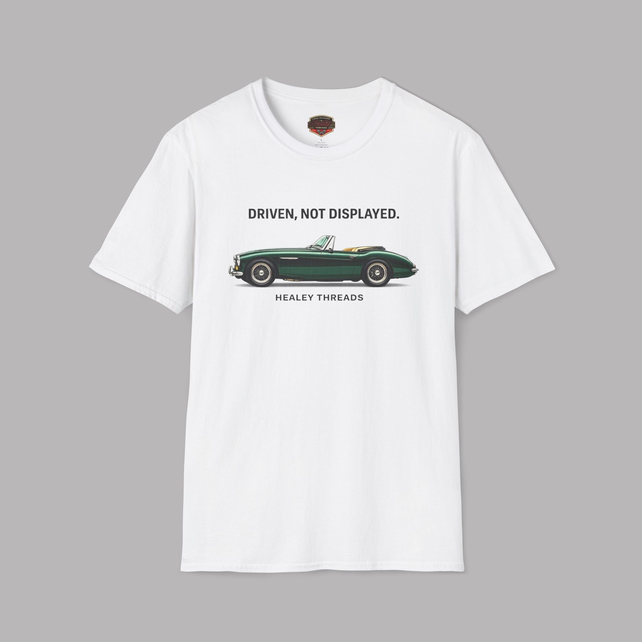 White t-shirt with a green classic car graphic and text on a gray background