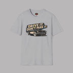 Gray t-shirt with a graphic of a car and text 'Drive it. Don't park it.' on a gray background