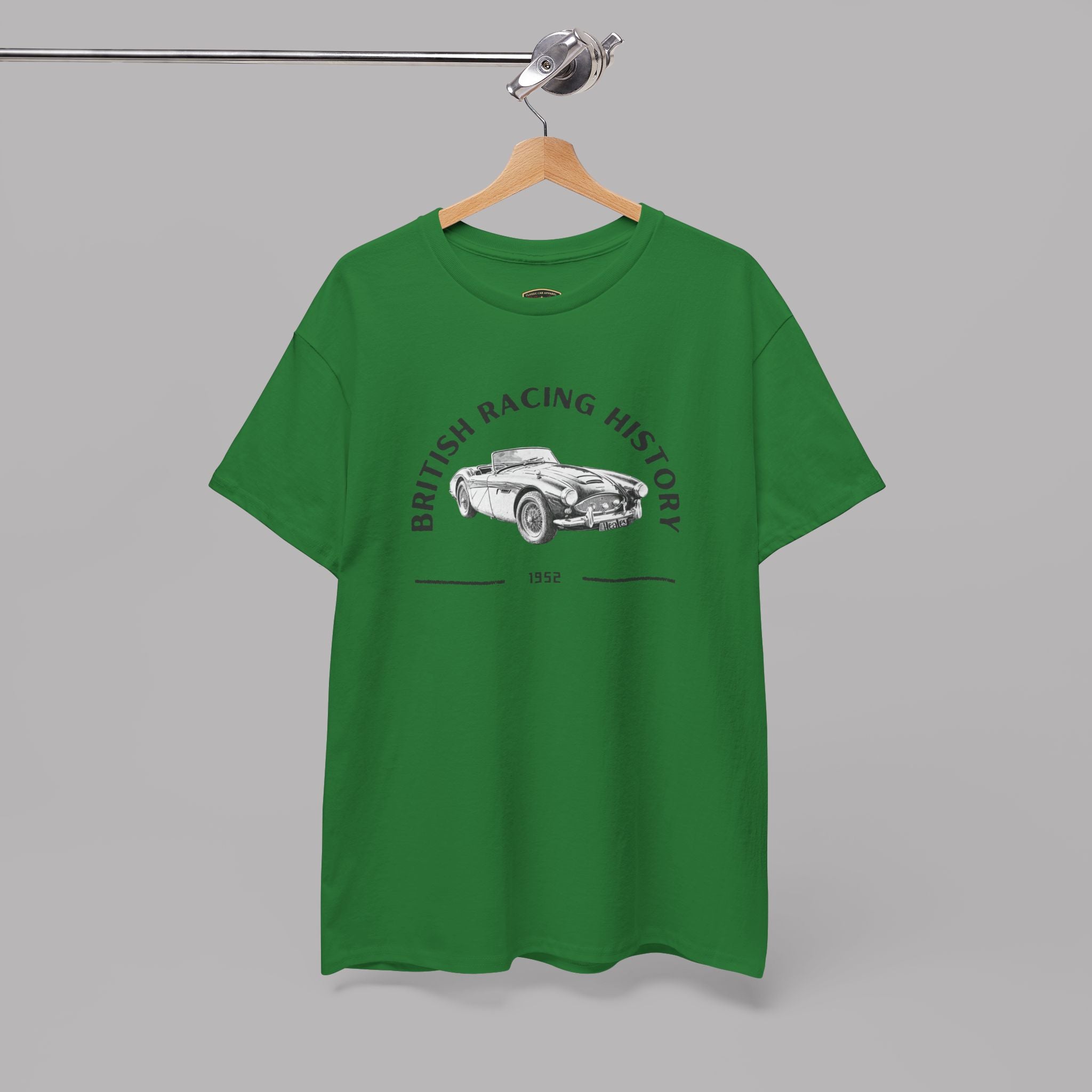 Turf green t-shirt with a classic car graphic design on a hanger against a gray background