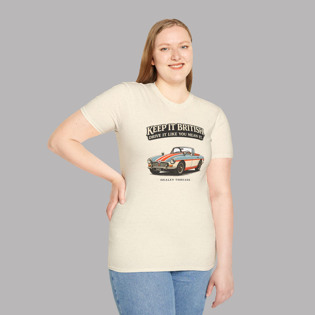 Woman wearing a natural t-shirt with a graphic MGB car design and text on a gray background