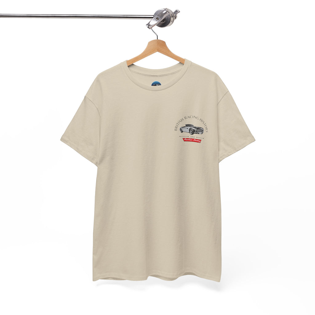 Beige t-shirt with a Healey graphic on a hanger against a white background