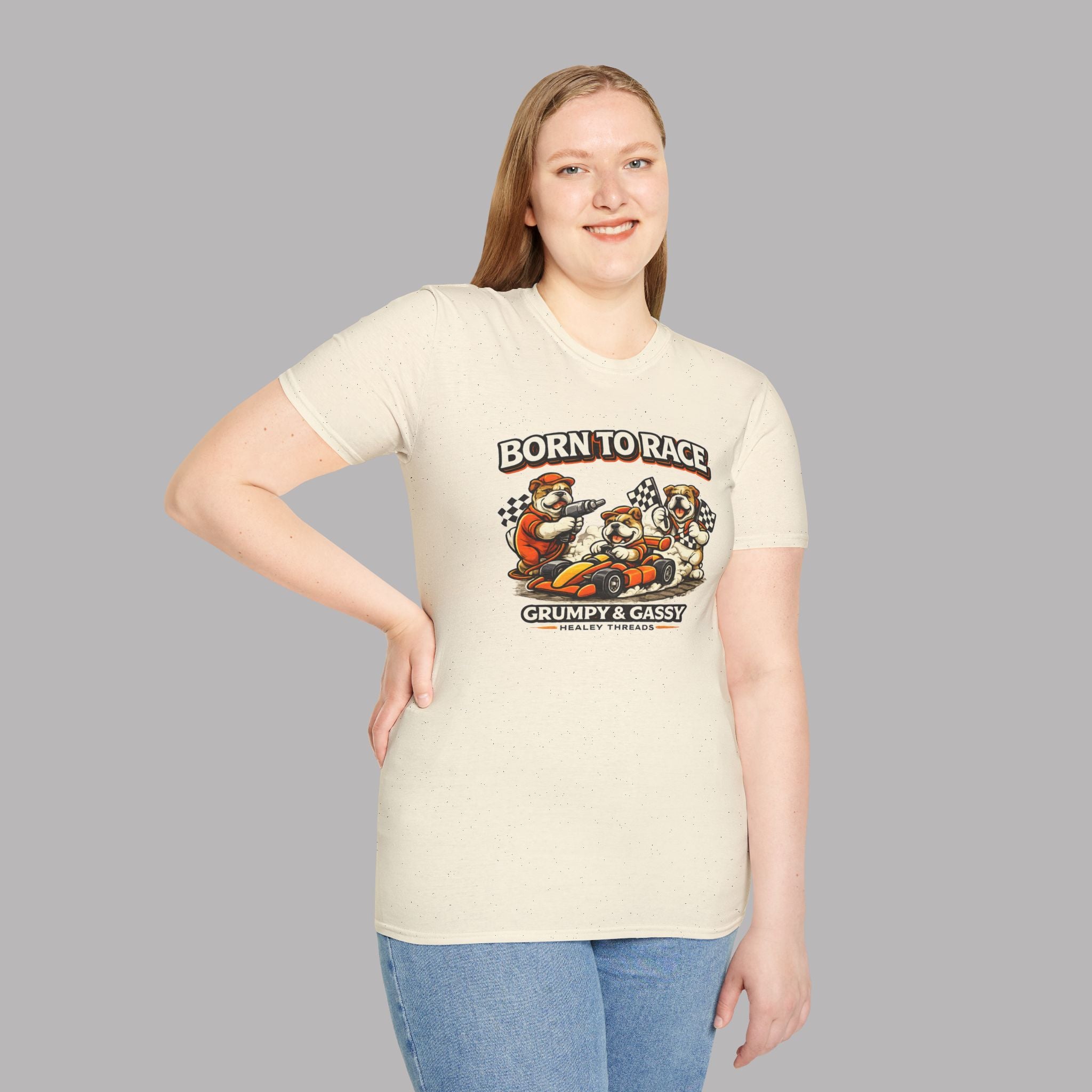 Woman wearing a natural t-shirt with a graphic 'Born To Race' design and text on a gray background