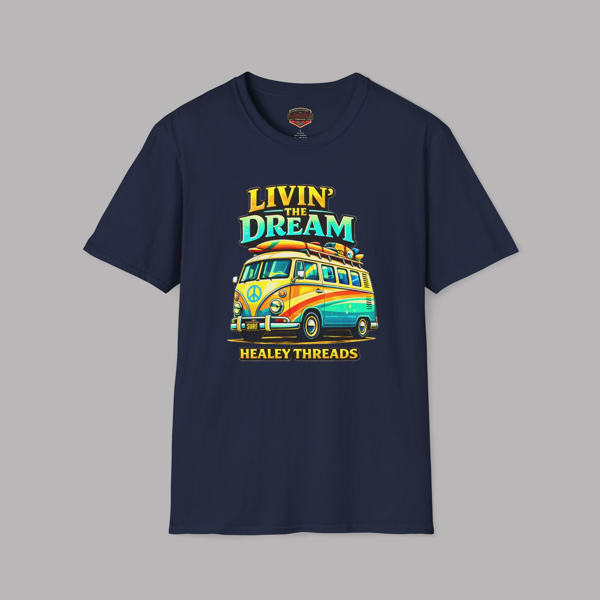 Navy blue t-shirt with a colorful van graphic and text on a gray background