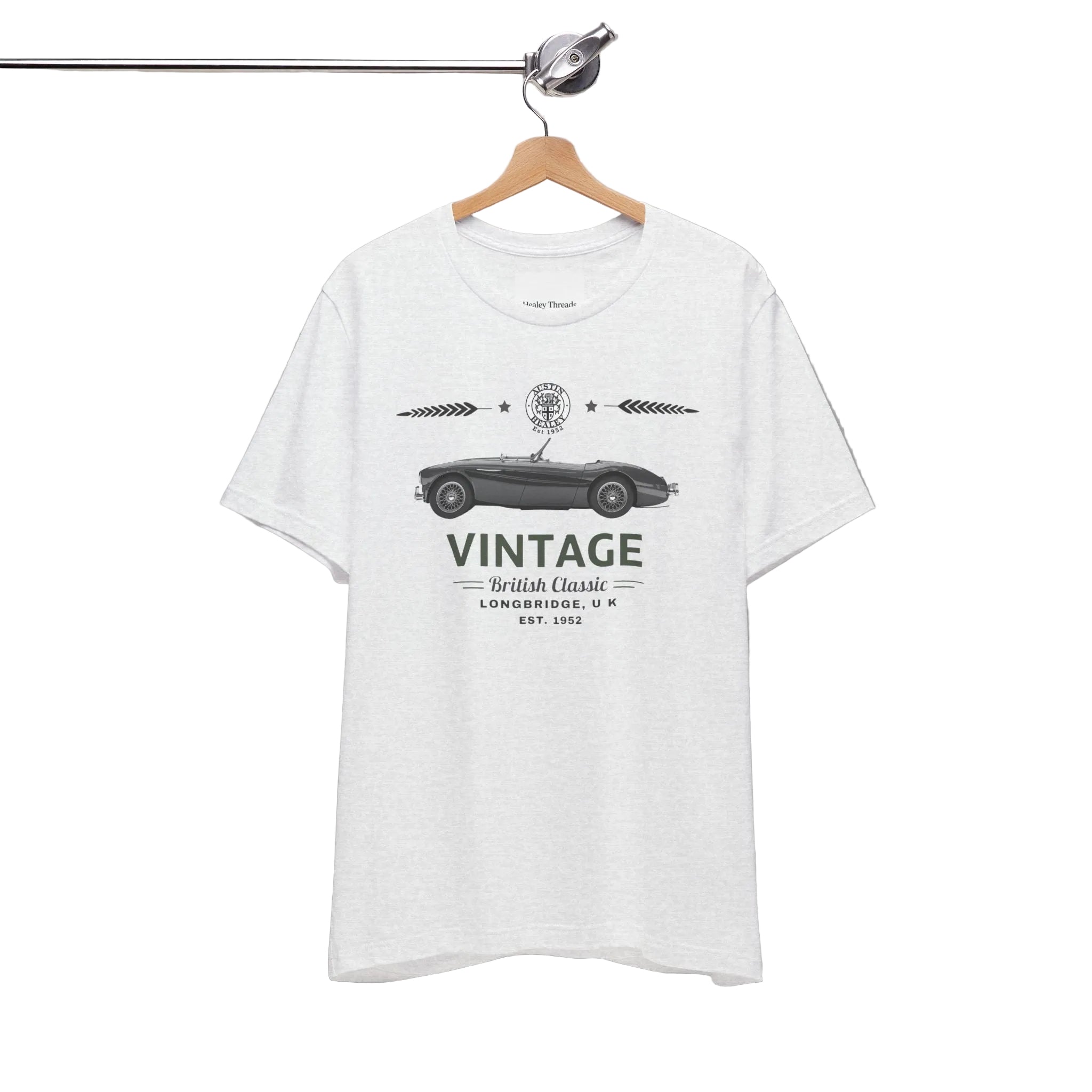 White t-shirt with vintage car graphic on a hanger against a white background