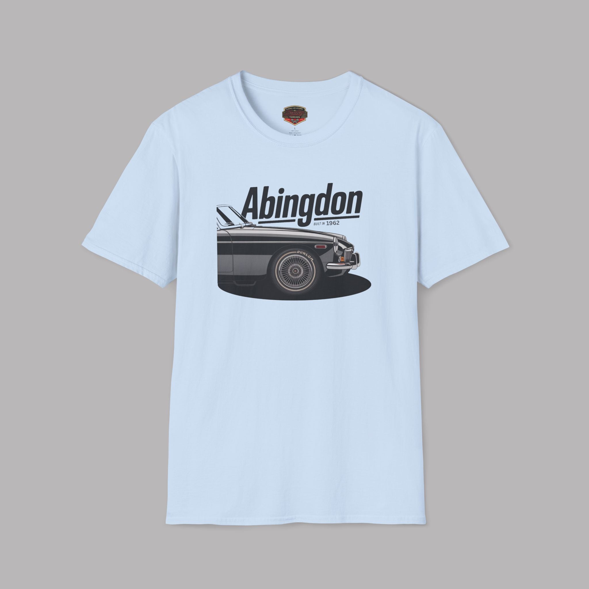 Light blue t-shirt with a graphic of a classic car and 'Abingdon' text on a gray background