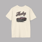 Back of a natural t-shirt with a classic car graphic and 'Healey' branding on a gray background 