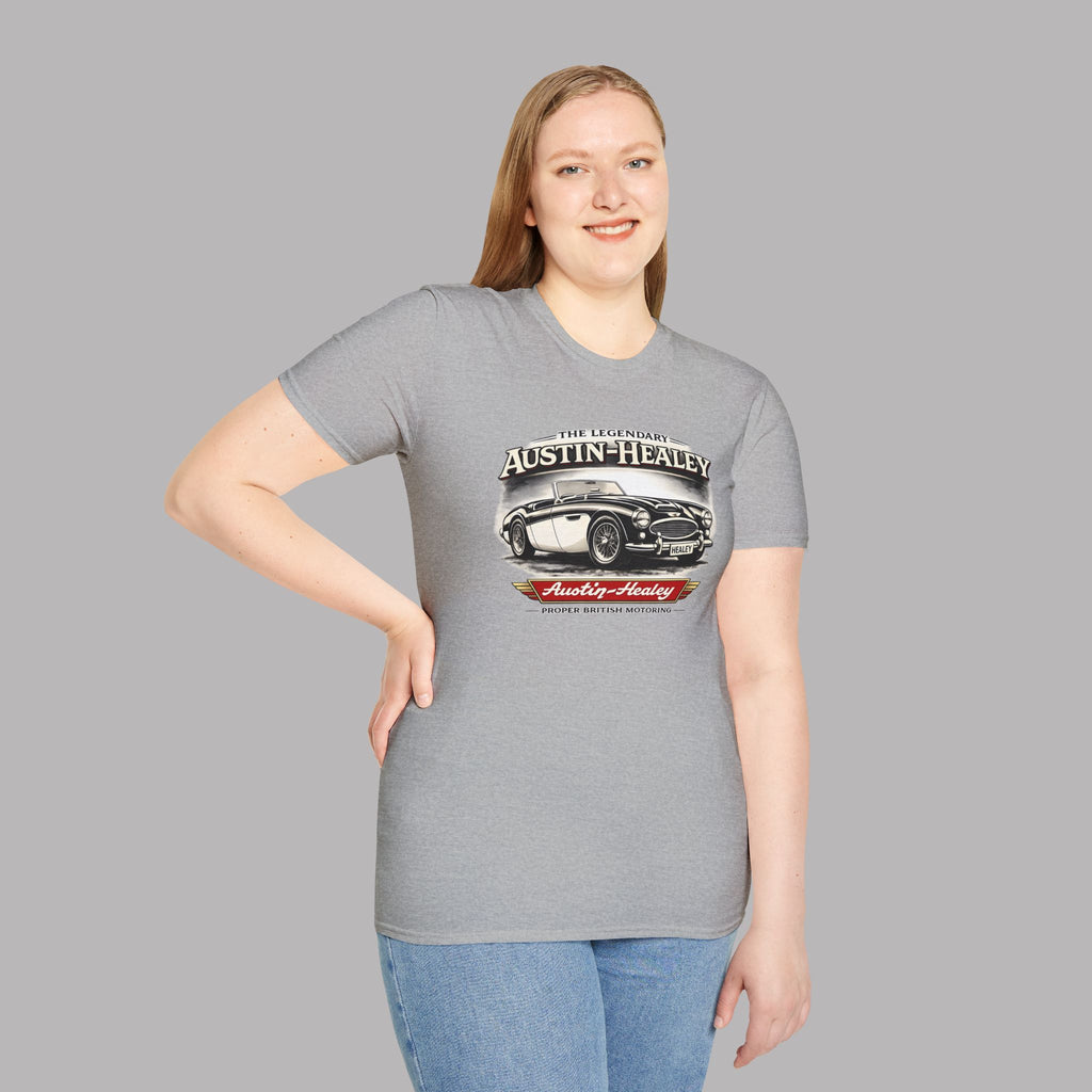 Woman wearing a gray t-shirt with Austin-Healey logo on a gray background