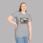 Woman wearing a gray t-shirt with Austin-Healey logo on a gray background