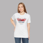 Woman wearing a white t-shirt with a graphic car design on a gray background