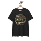 Black t-shirt with classic car graphic and text on a hanger against a white background
