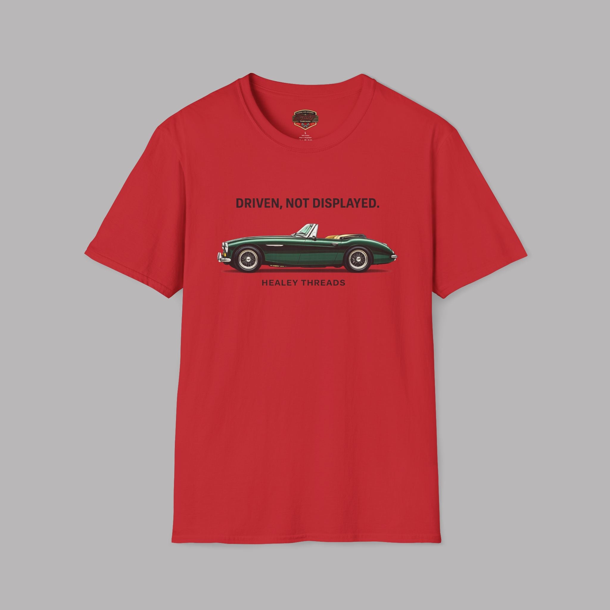 Red t-shirt with a green classic car graphic and text on a gray background