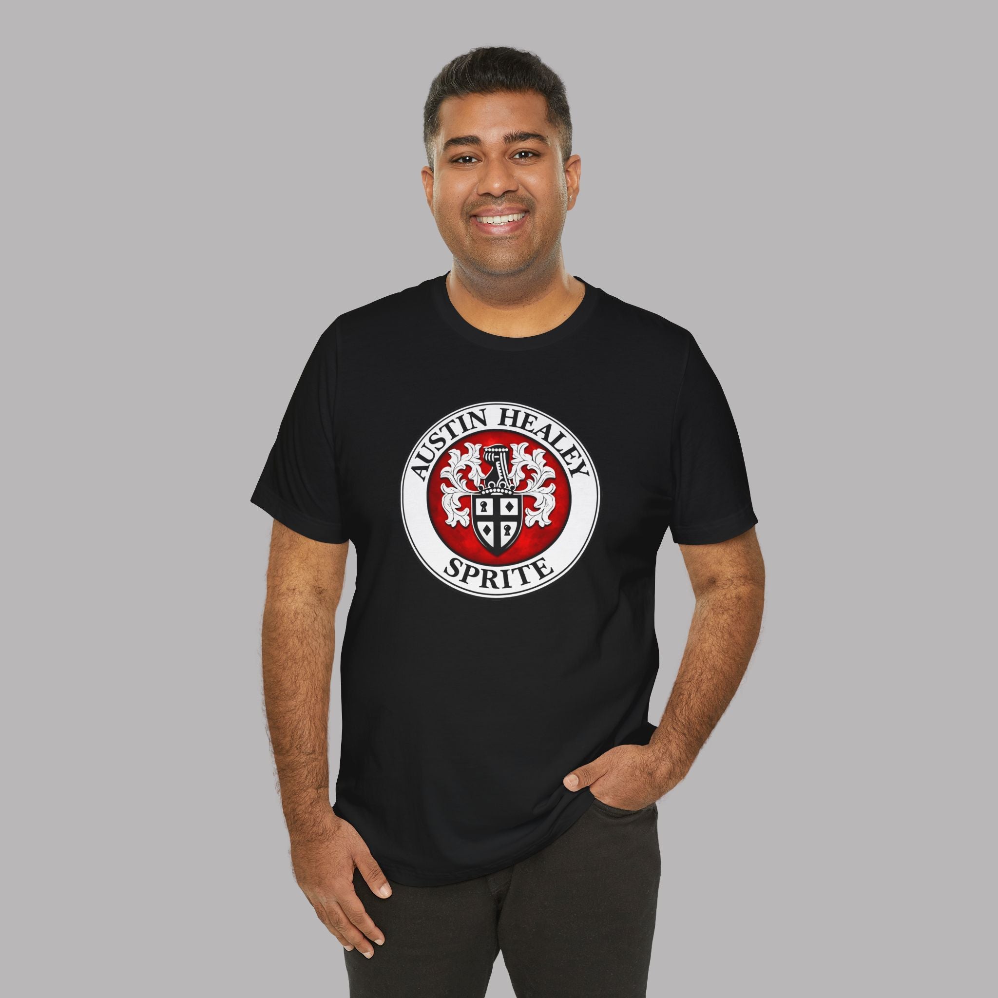 Man wearing a black t-shirt with a red and white Sprite logo on a gray background