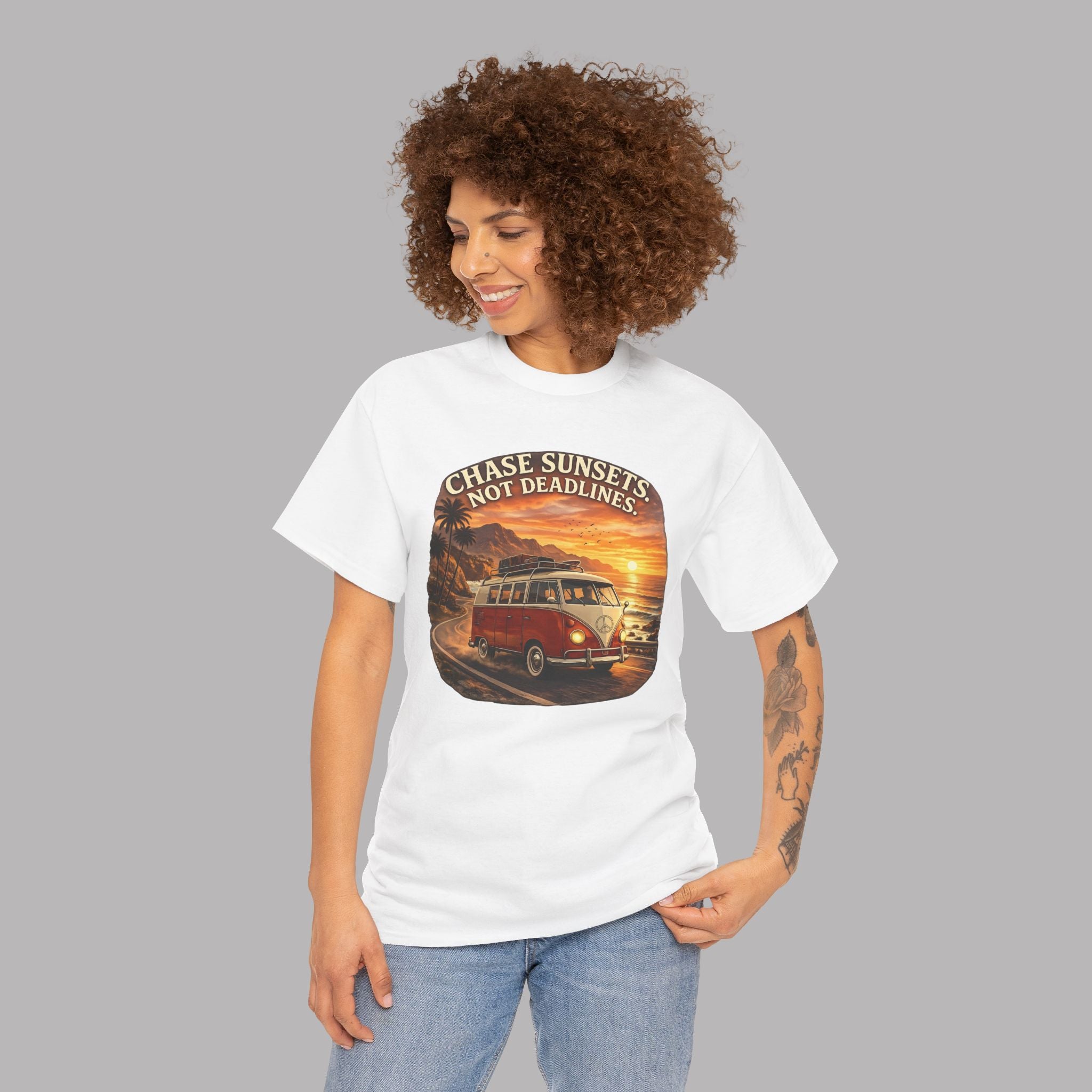 Woman wearing a white t-shirt with a classic red van graphic design and text on a gray background