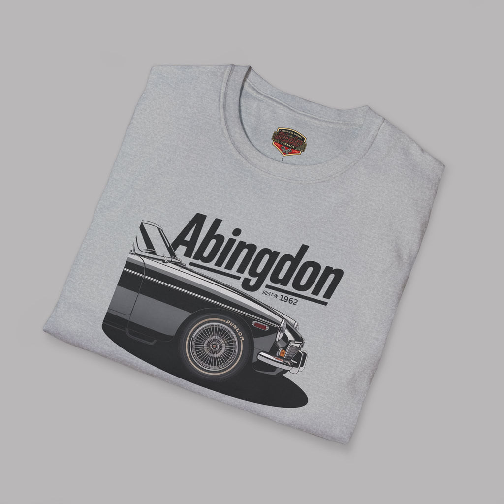 Folded gray t-shirt with classic car graphic and 'Abingdon' text on a gray background