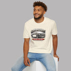 Man wearing a white t-shirt with Austin-Healey logo sitting on a white stool against a gray background