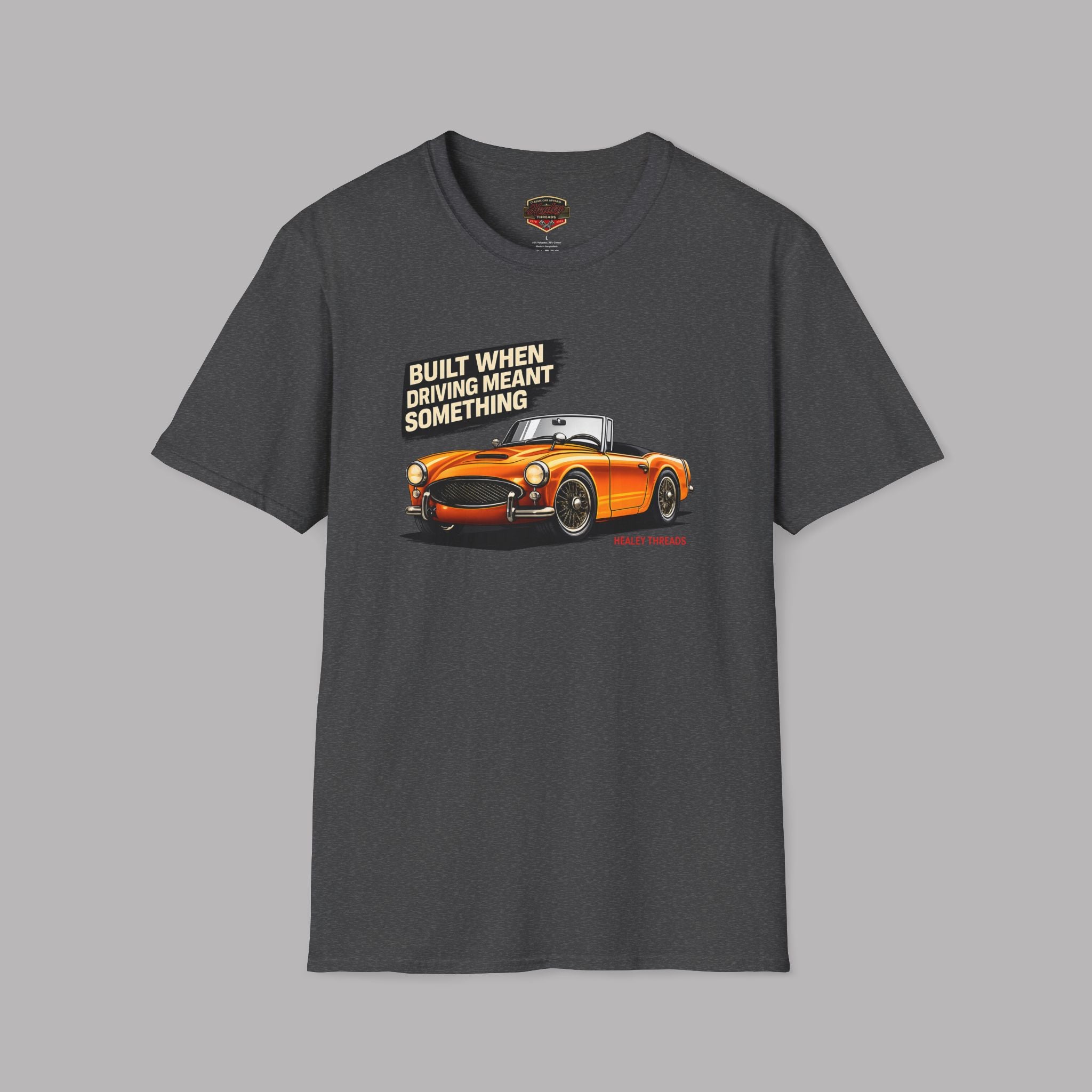 Dark heather t-shirt with orange classic car graphic and text on a gray background