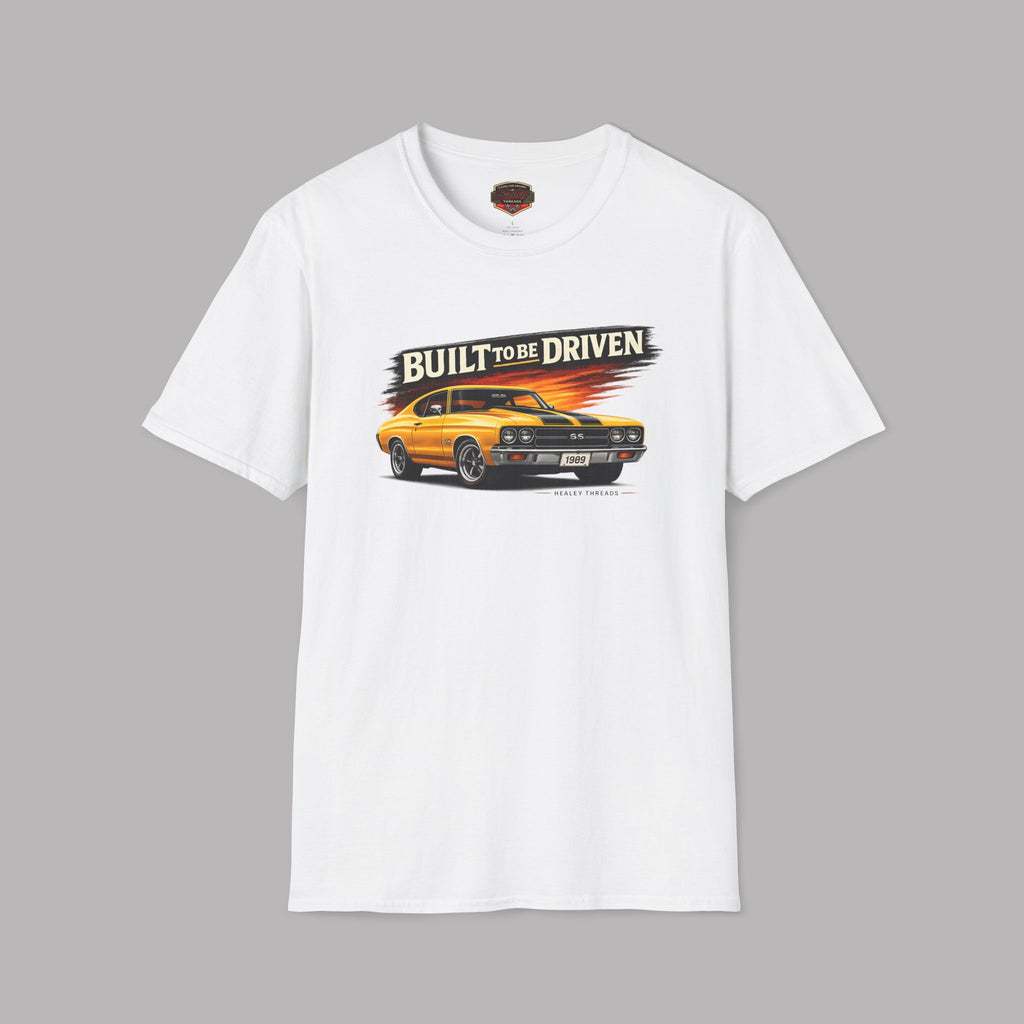 White t-shirt with a graphic of a car and 'Built to be Driven' text on a gray background